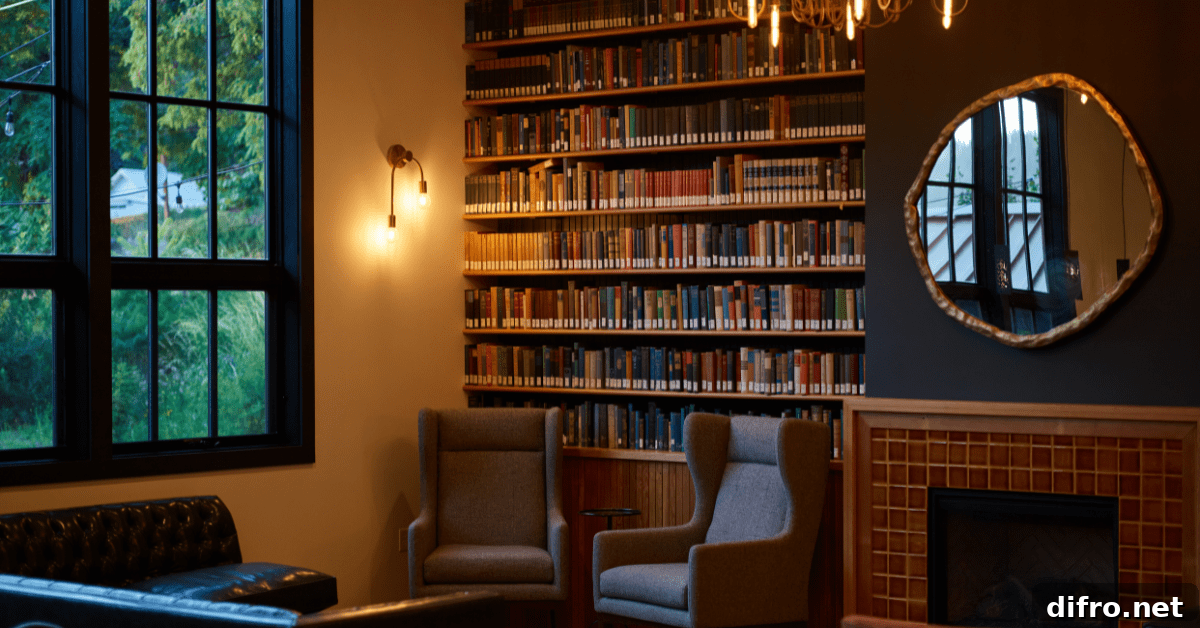 Cozy room with bookshelf that reaches the ceiling.
