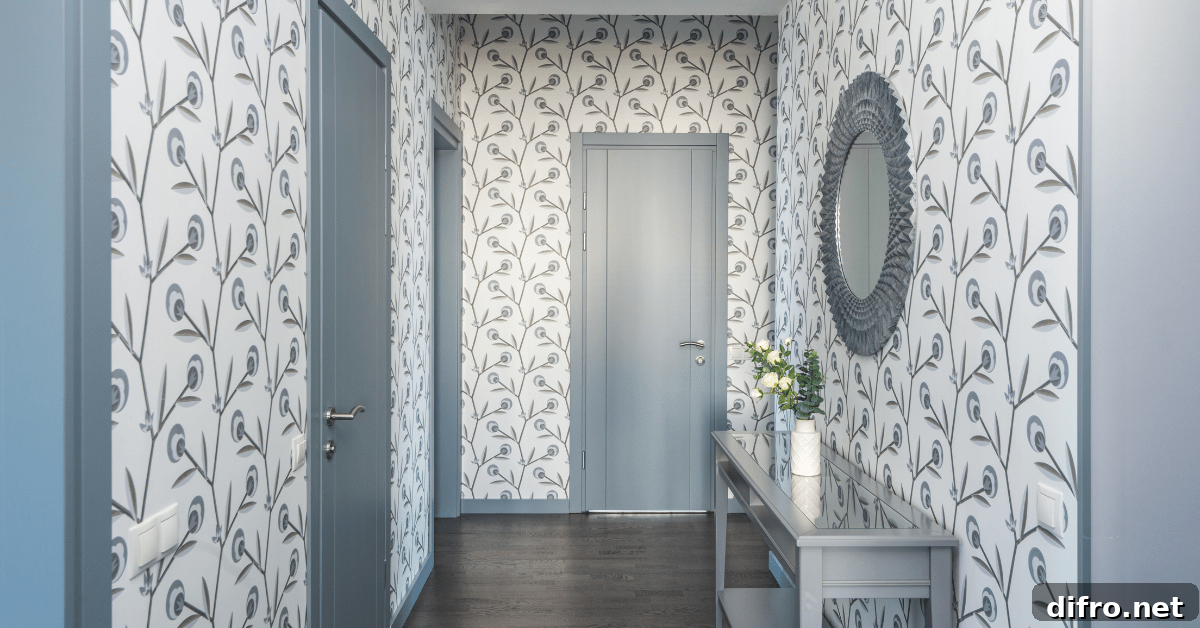 Entryway with blue and white wallpaper.