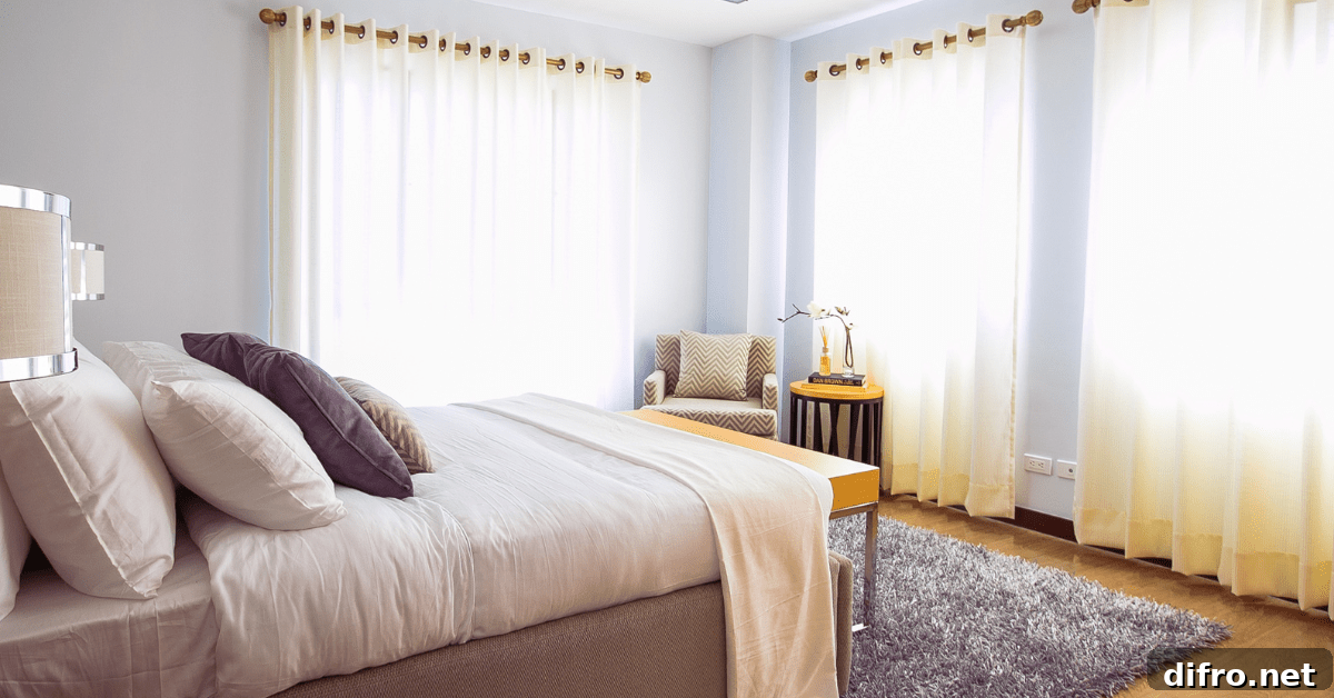 Bed with comforter in a bedroom.