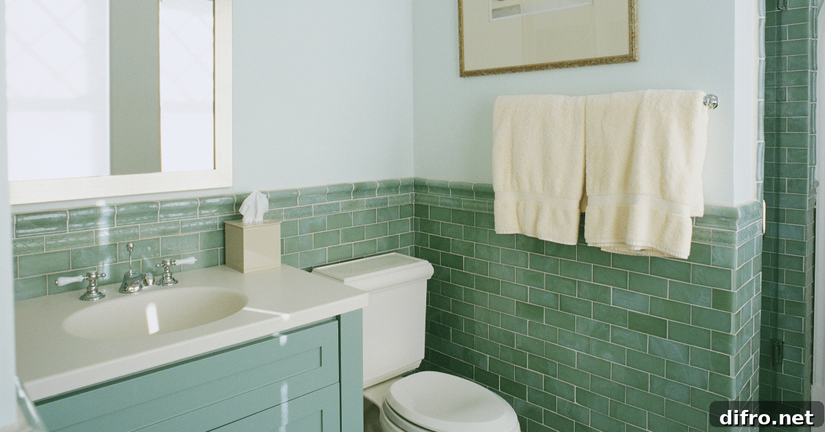 A bathroom with mint green finishes.