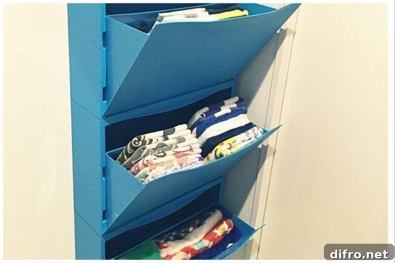 Blue shoe cabinet holding towels.