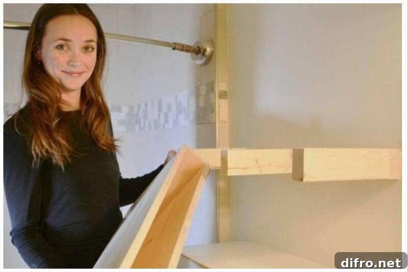 Woman holding wooden floating shelve.