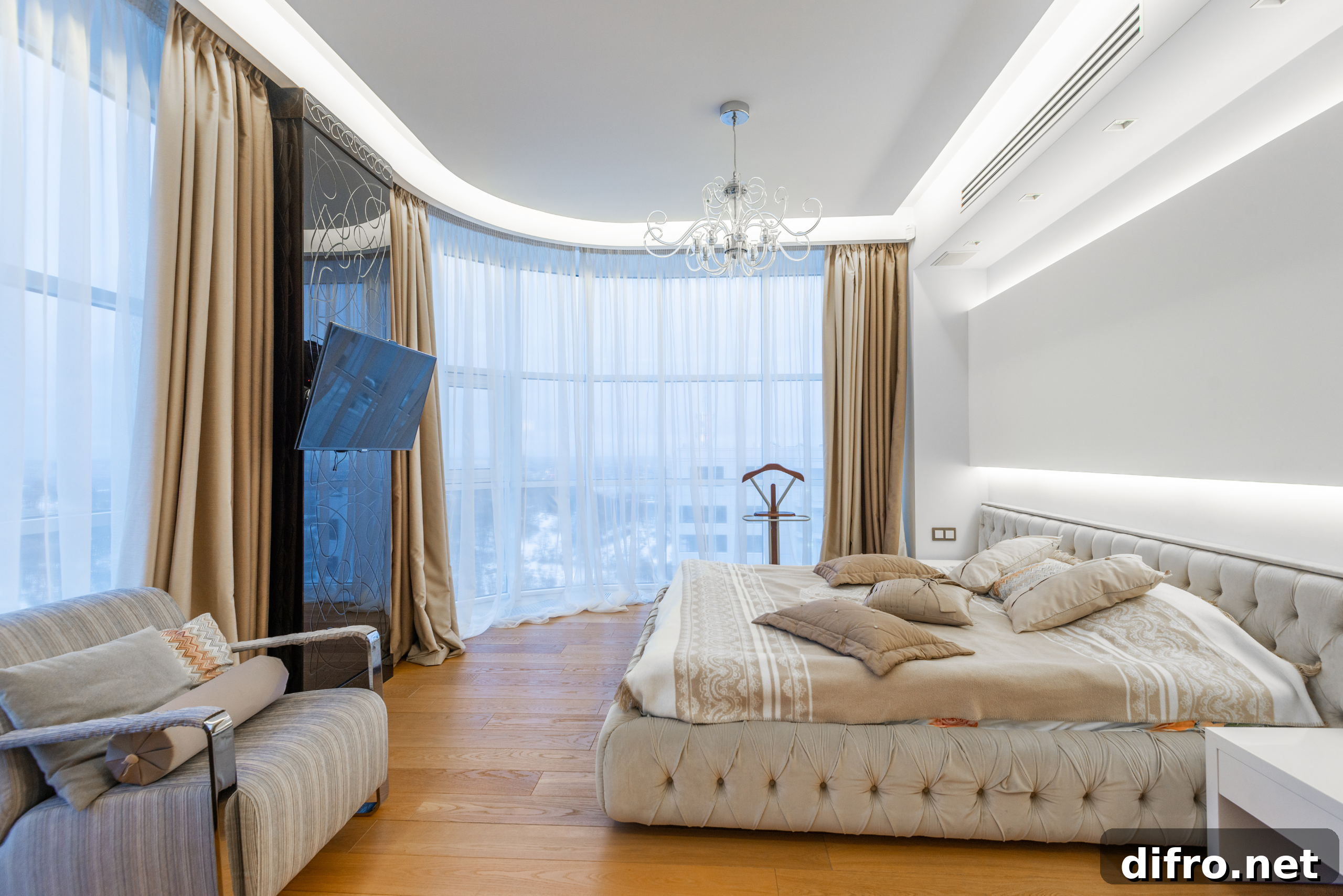 Bedroom with various luxurious finishes.