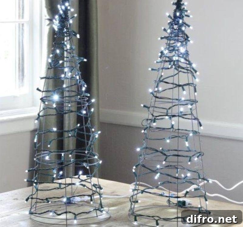 Two blue tree-shaped wired Christmas lights.