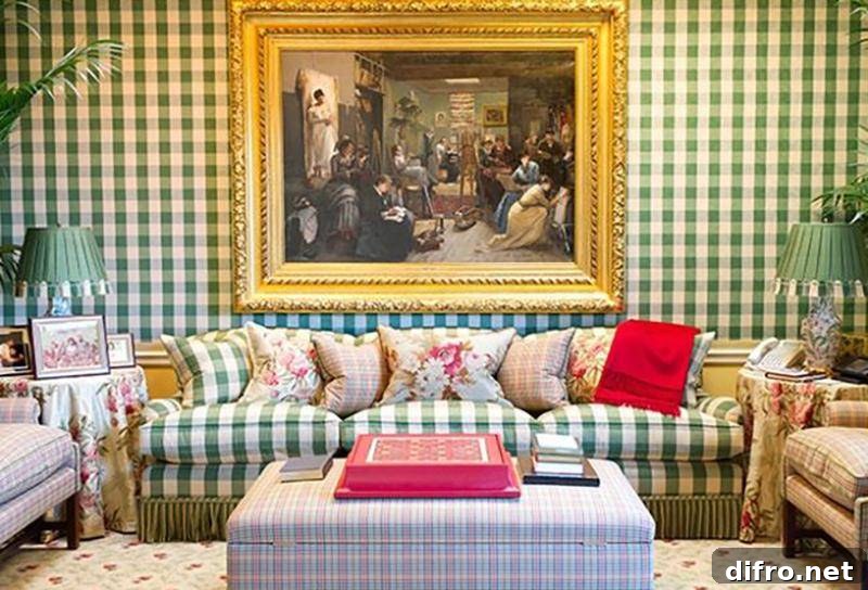 One of Oprah's living room has plaid walls, couches, and ottoman.