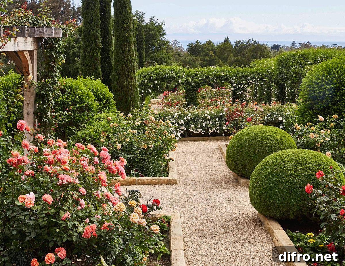 Oprah's garden features hedge arches, flowers, and wooden arches.