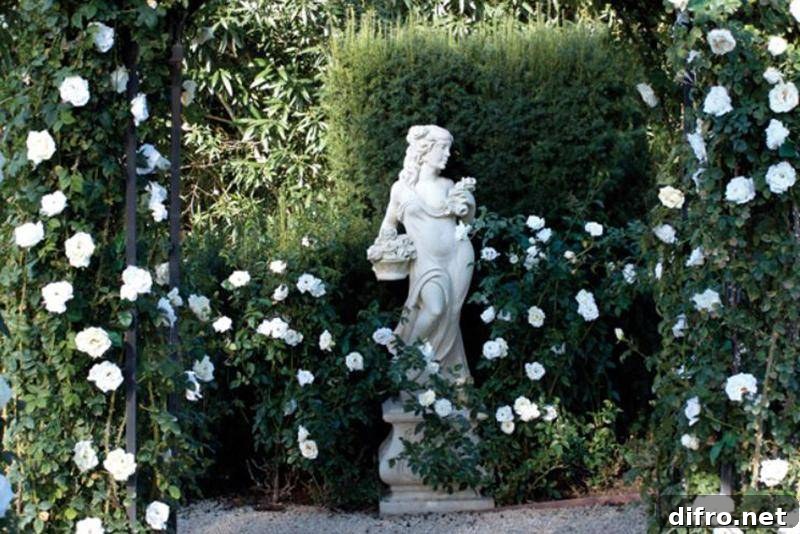 A statue and hydrangeas line hallelujah lane in Oprah's garden.