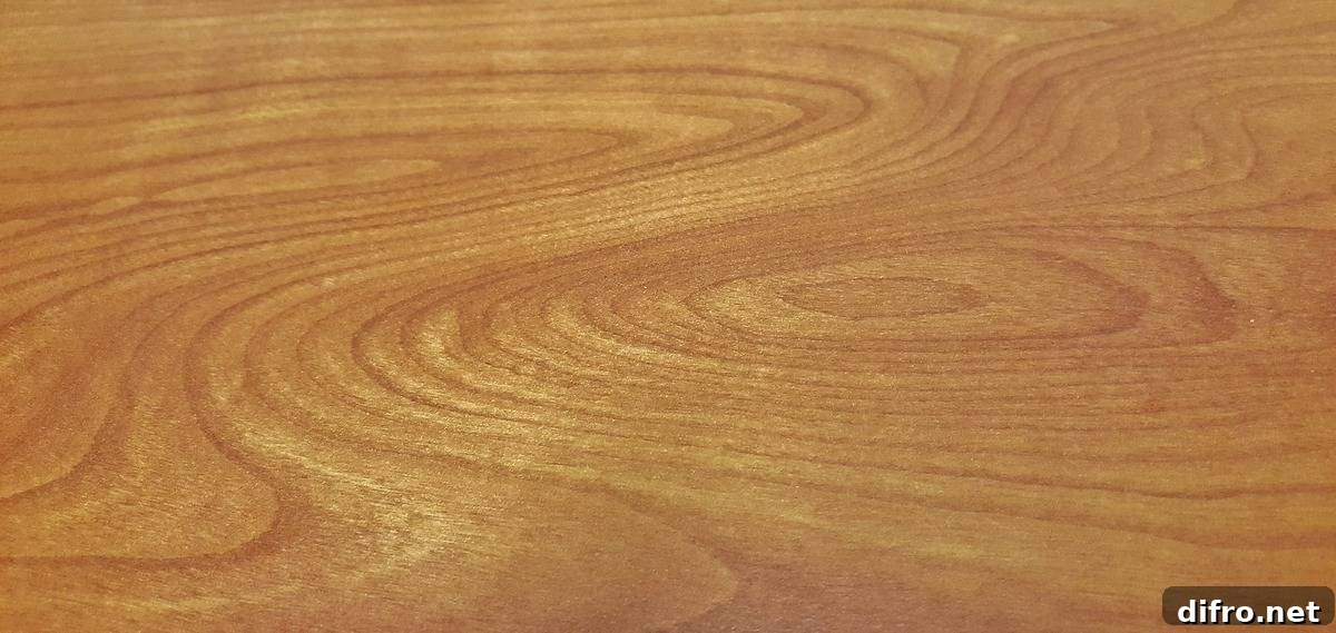 A close-up shows grains of wood.