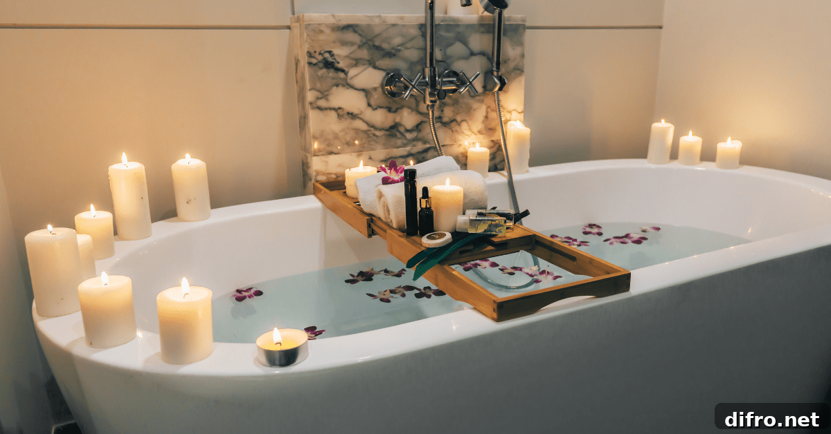 Large white bathroom tub with candles on the edge.