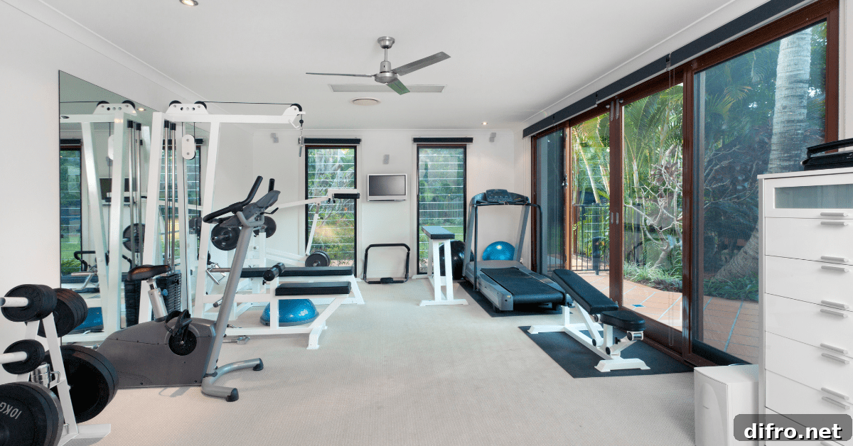 Spacious home gym with large windows.