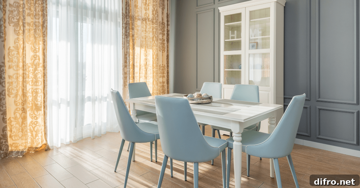 Blue chairs and a white dining room table.