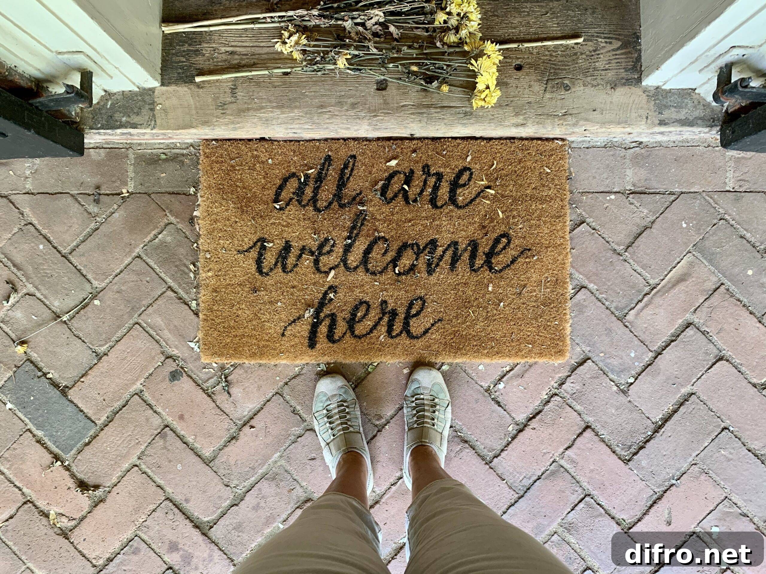 all are welcome here straw doormat at front door