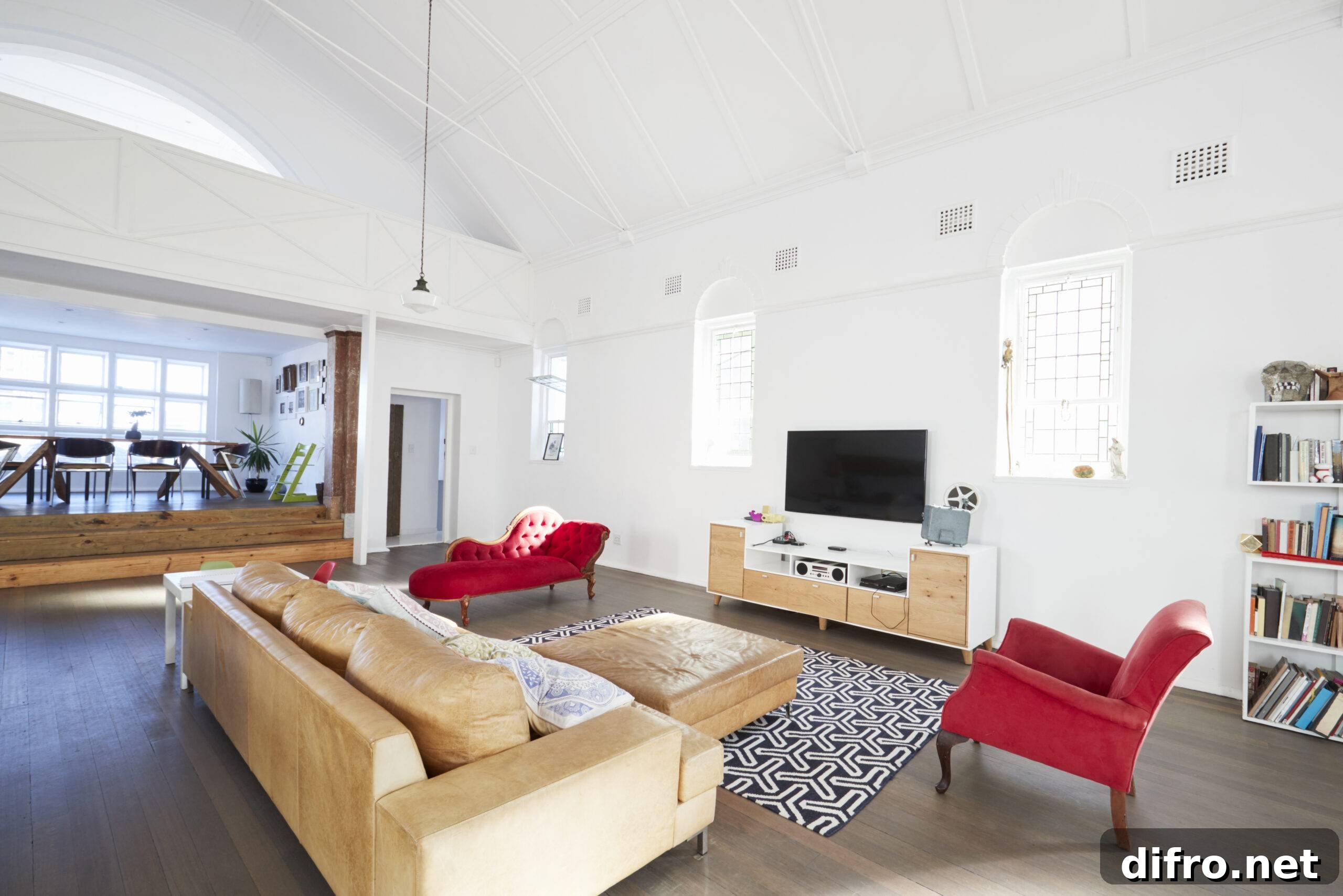 A living room with two red accent chairs.