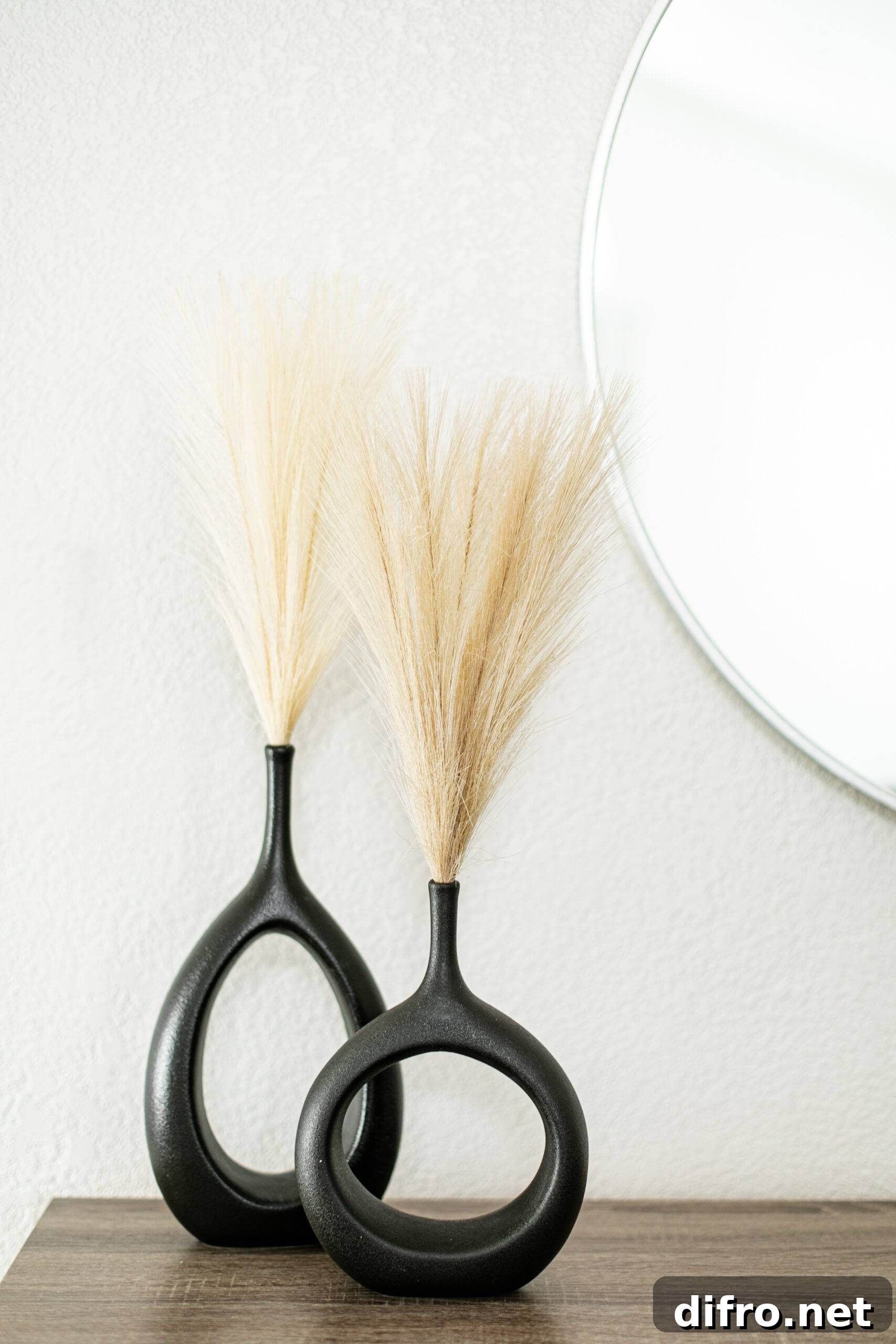 Pampas grass in modern black vases.