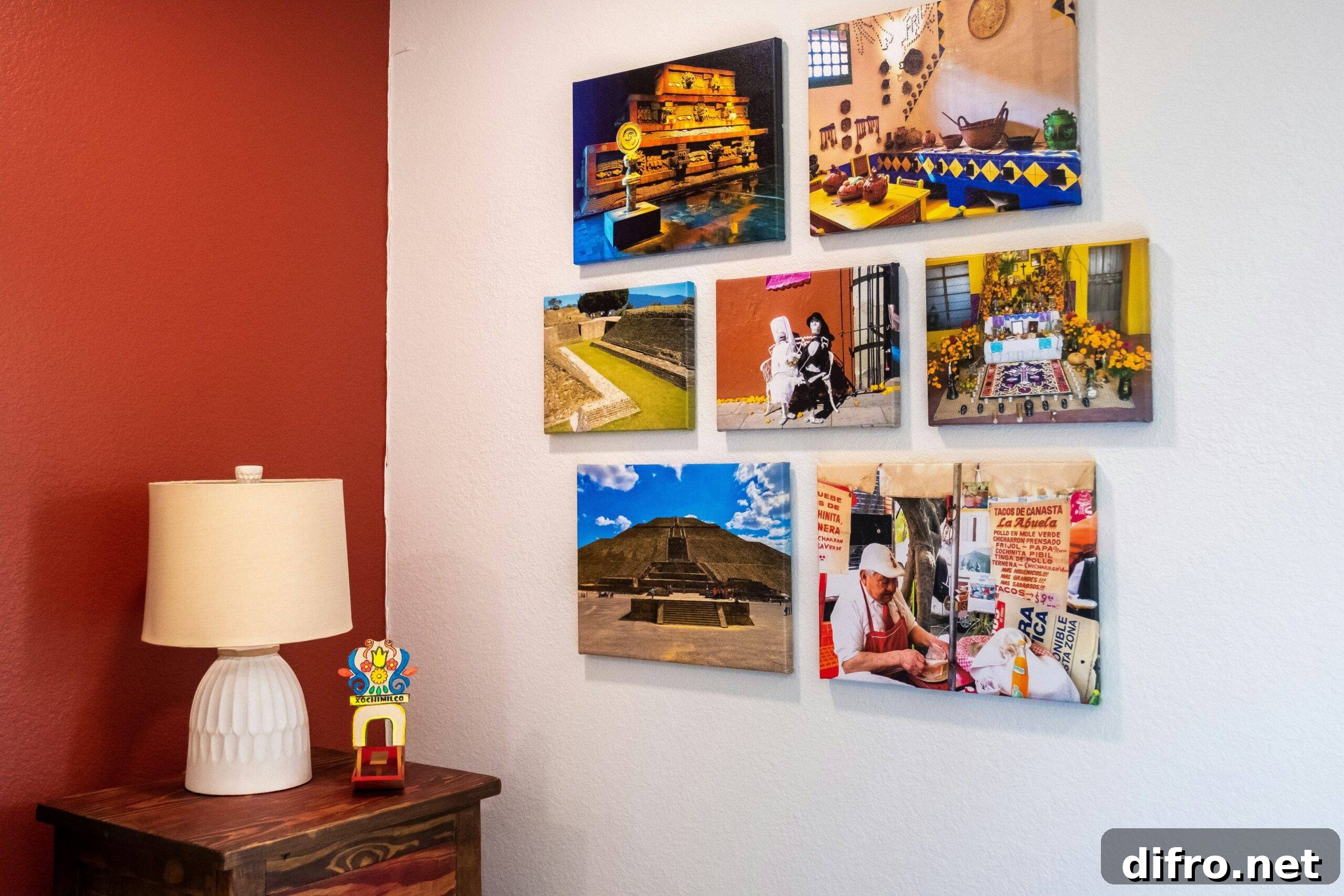 A selection of printed photos hanging together on a wall near an end table.