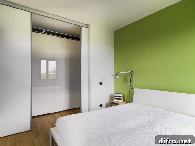 5 Space-Saving Hidden Bed Ideas to Keep a Guest Bed Ready 4 interior view of a modern bedroom with wood floor whose wall is painted of green overlooking on the corridor