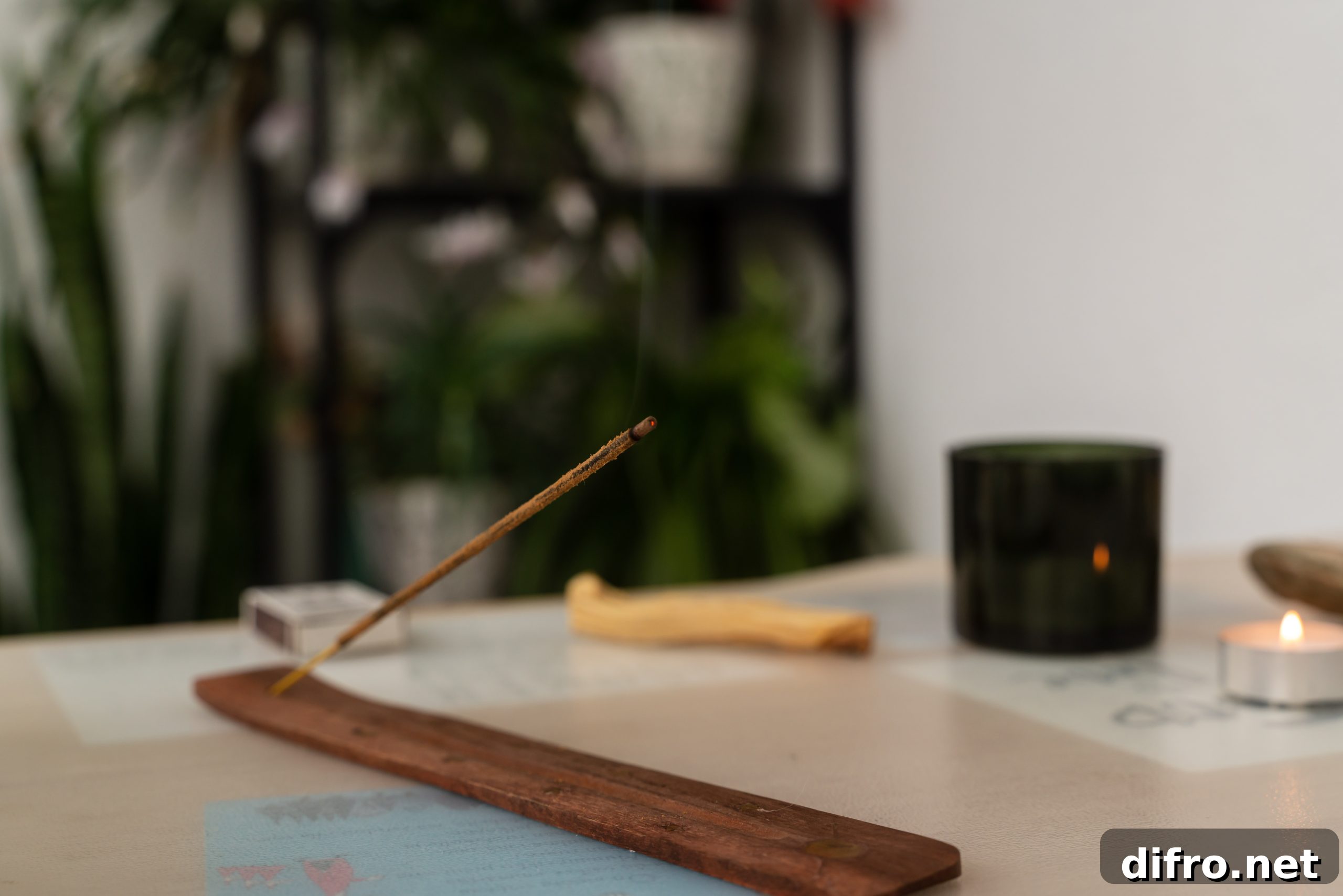 Burning aromatic incense wooden stick for meditation and relaxing smoldering on table. Aromatherapy smoke.