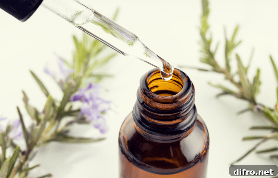 A close photo of a bottle of essential oil, the dropper removed right above the opening.