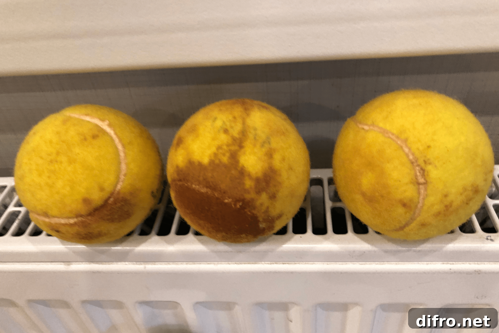Do Tennis Balls Work as Dryer Balls? Pros and Tips for Laundry 4 Three dirty tennis balls.
