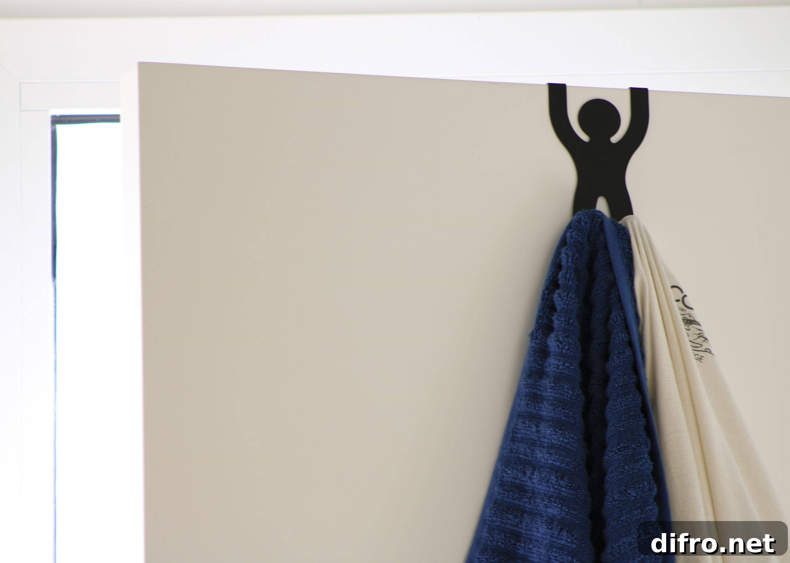 An over-door towel hook in the shape of a stick figure.