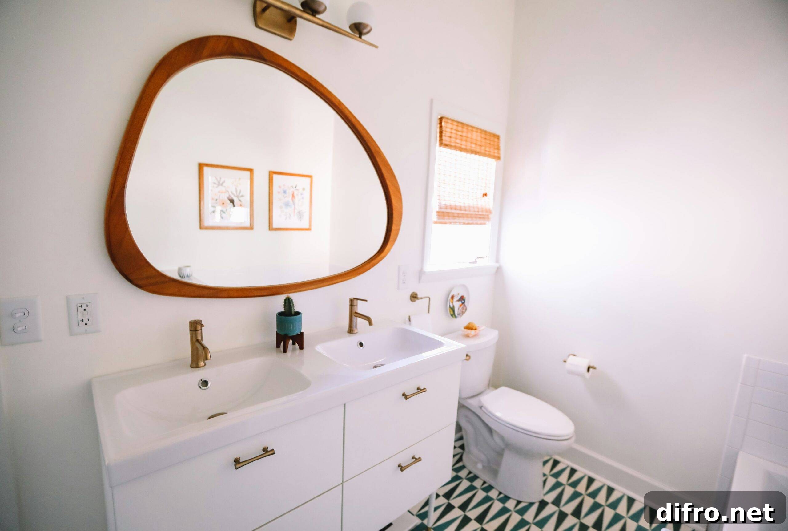A bathroom with a large, rounded framed mirror.