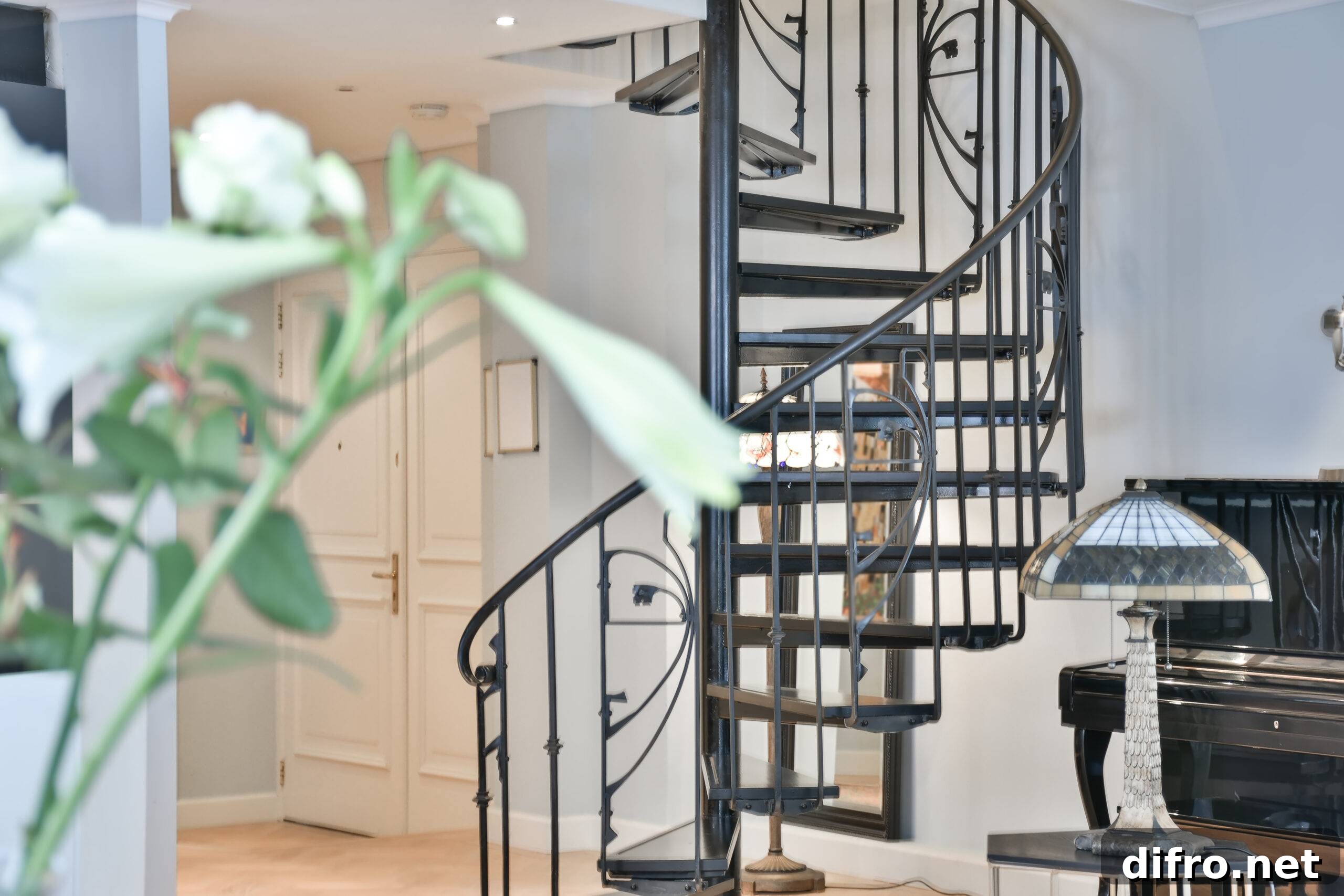 Designed in a minimalistic style staircase hall. Interior of luxury house stairs