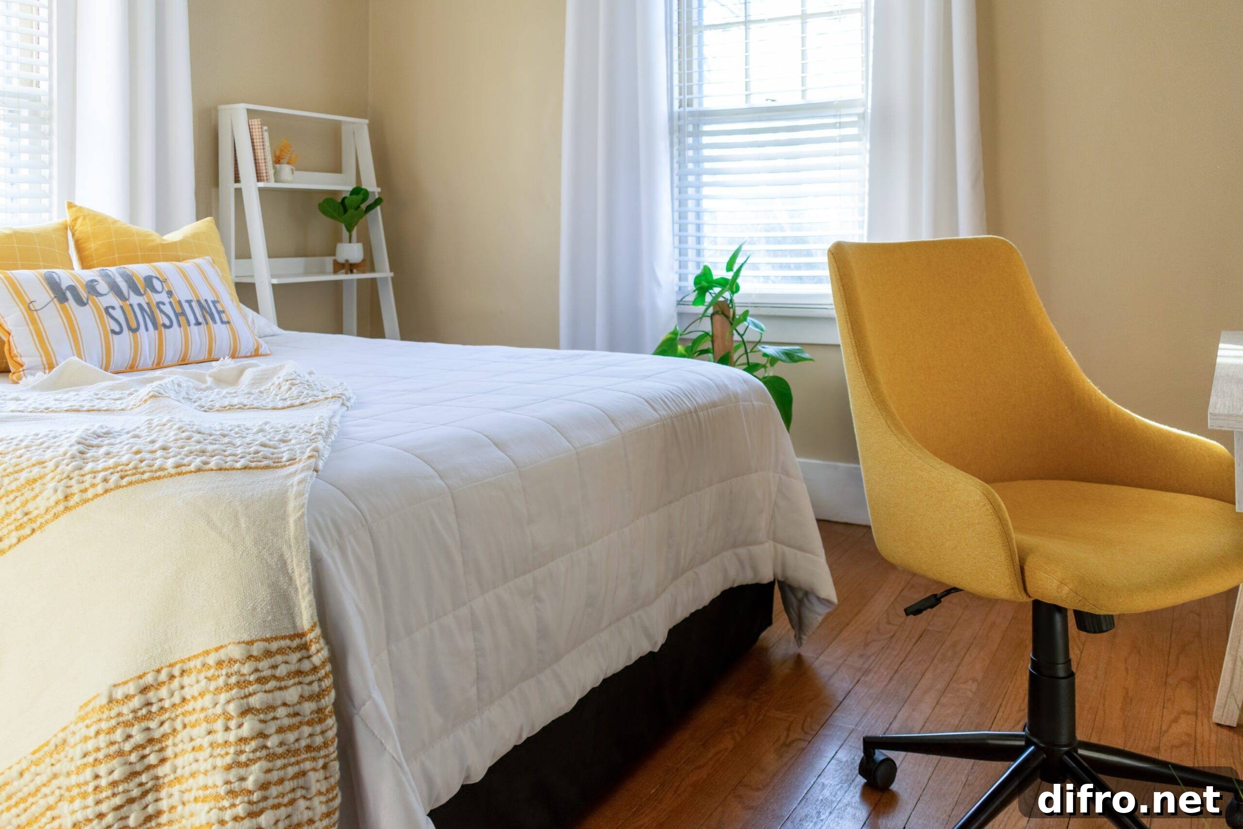 Small stylish bedroom with desk decorated in yellow and white