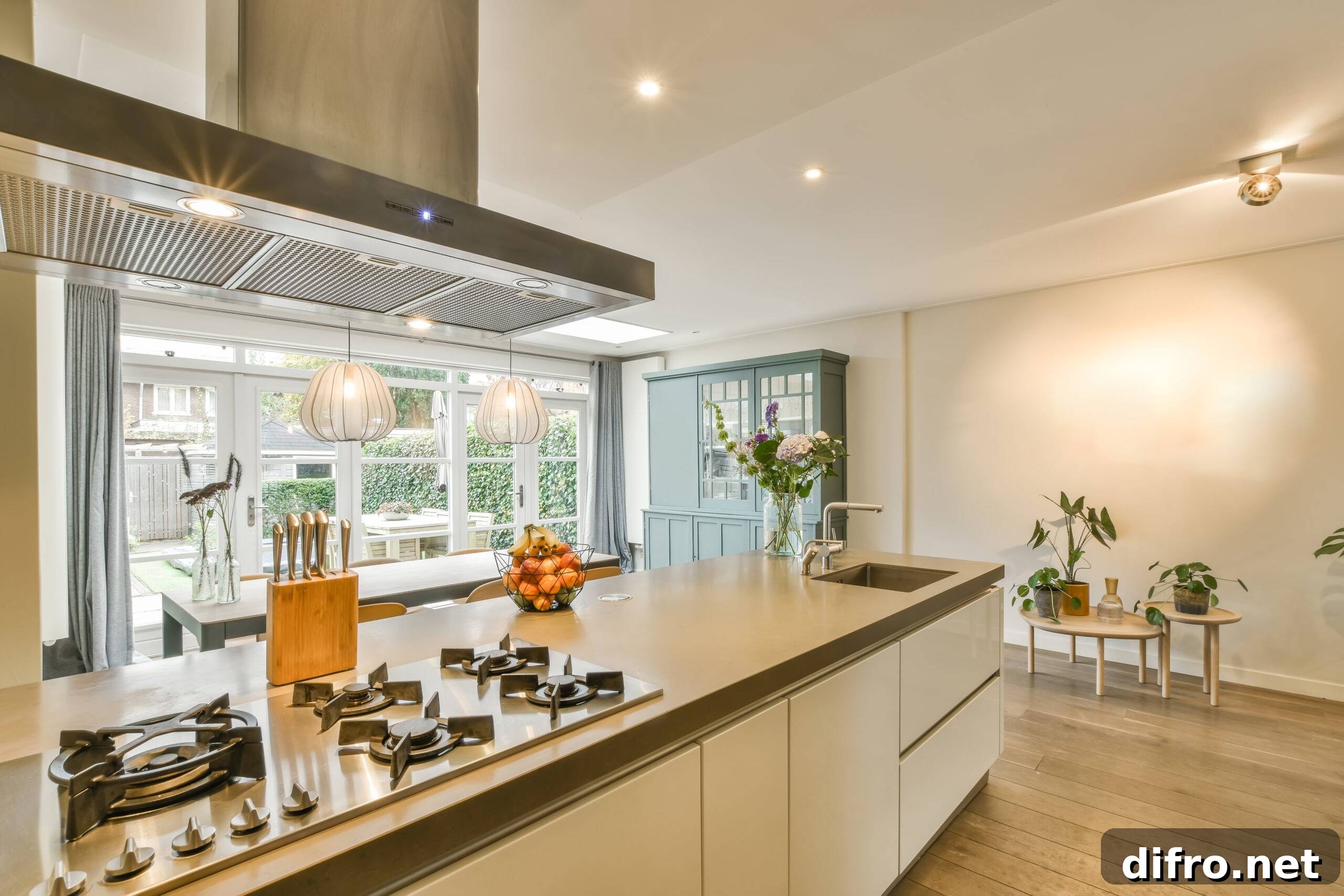 Cozy and strong kitchen area in daylight with flowers