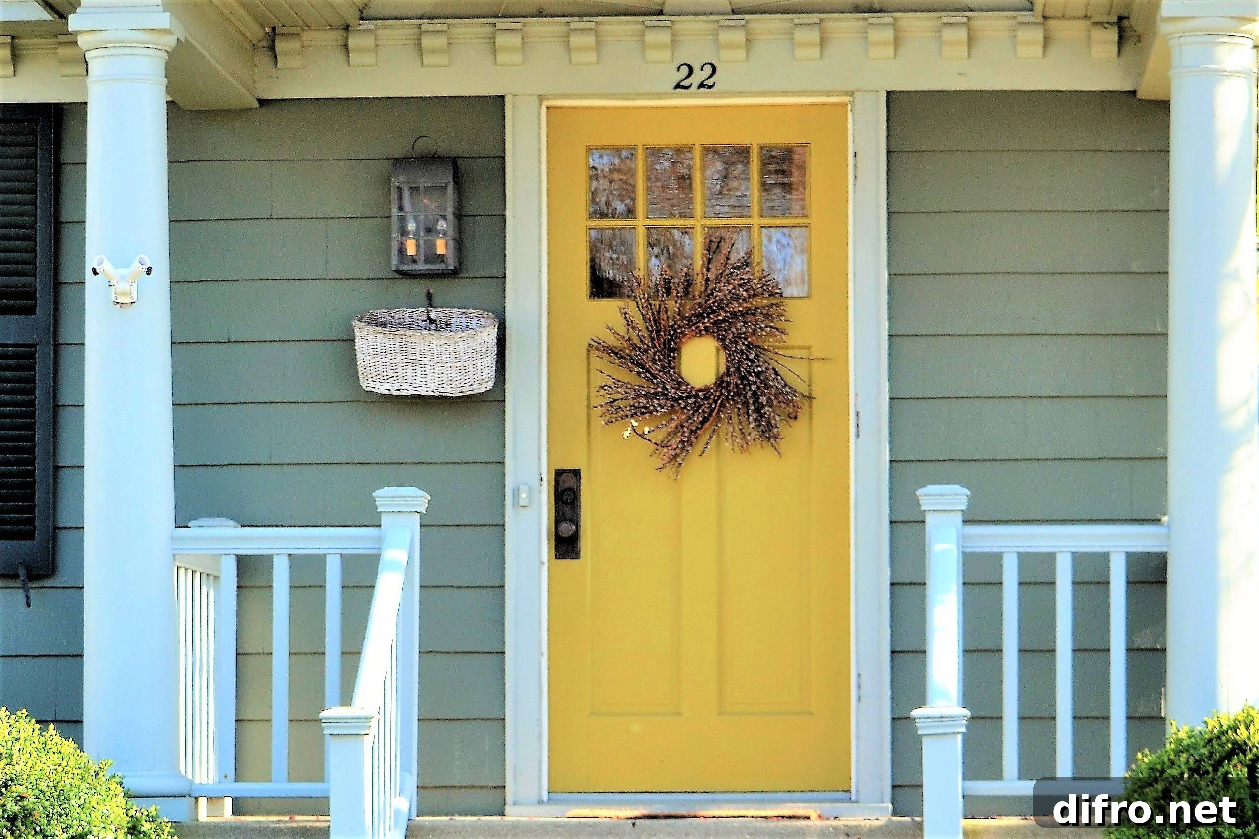 The front of a house with a yellow door.