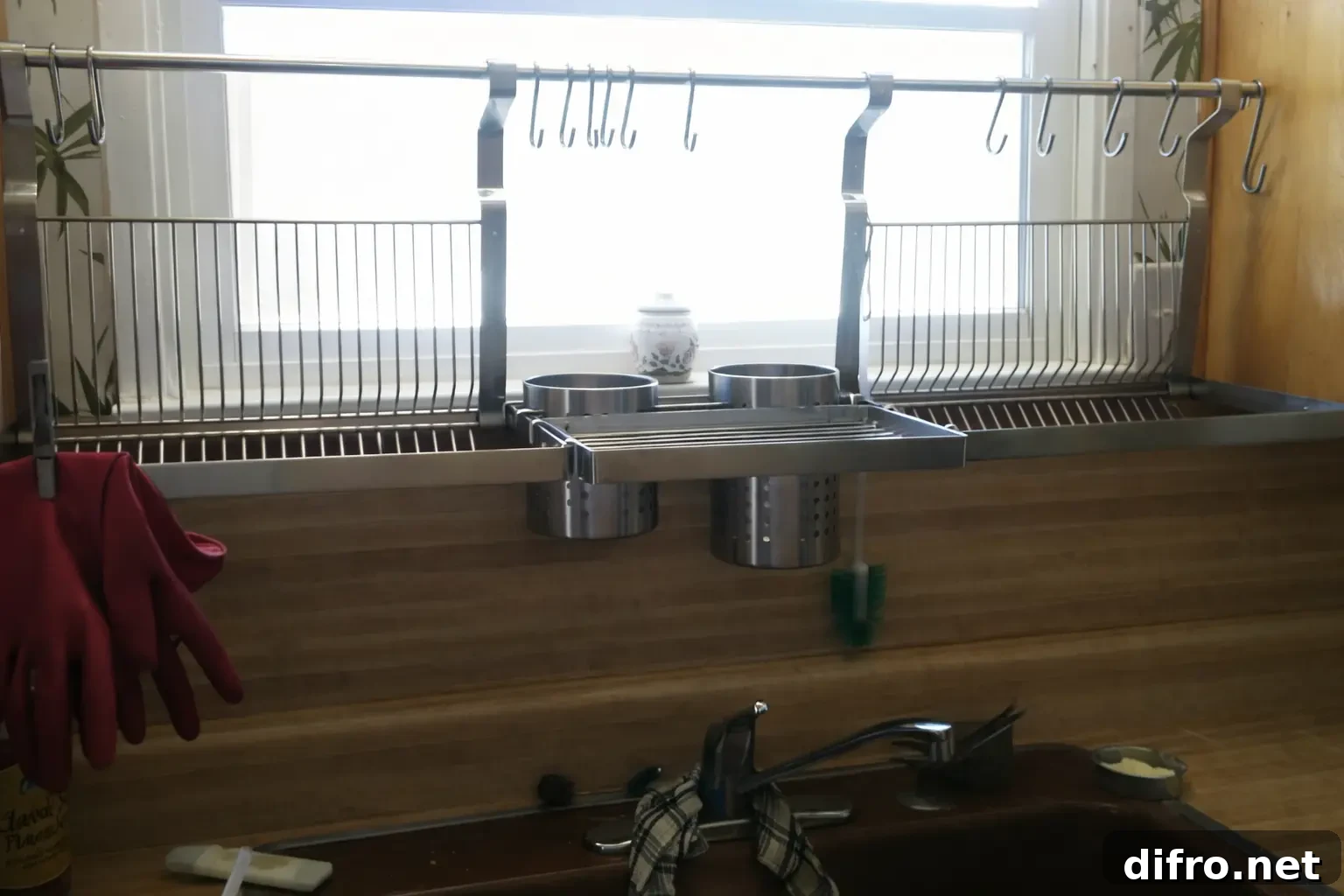 Finnish Dish Drying Cabinet: Martha Stewart's Space-Saving Tip 6 An image of a chrome Finnish dish drying rack 'astiankuivauskaappi' kept above a sink