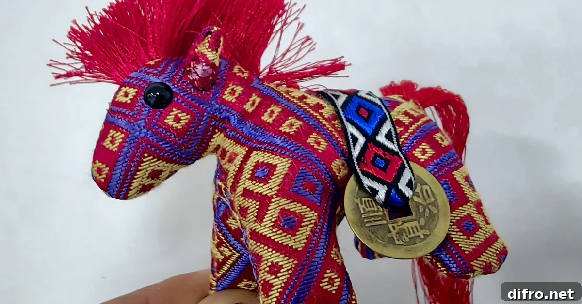 Handmade Year of the Horse zodiac ornament photographed at the workshop of Zhuangjin Intangible Cultural Heritage Inheritance Center in Xincheng County, Laibin City, Guangxi, China on December 23, 2025.