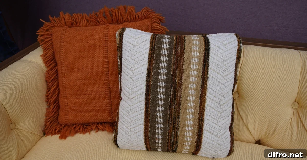 Striped cushio against solid shades in living room decor.