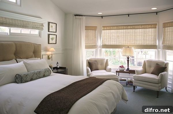 Bedroom with a neatly made bed and down comforter