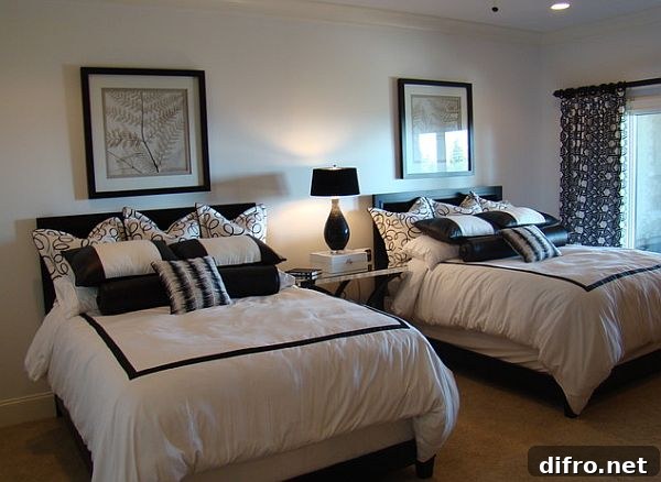 black and white guest room with twin beds