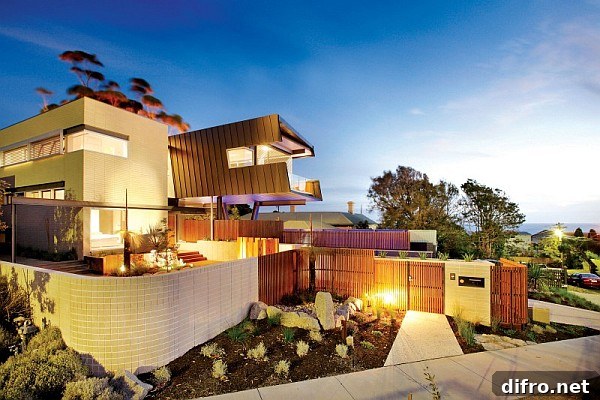 Cantilevered upper level with zinc cladding