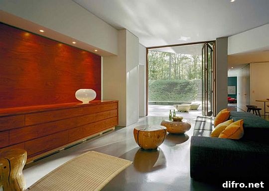 Living area bathed in daylight with panoramic glazing