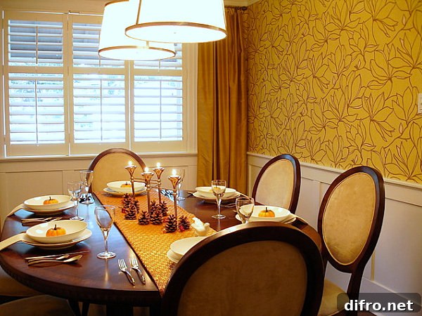 A Thanksgiving centerpiece with pine cones and candles