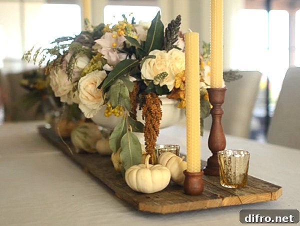 A Thanksgiving floral centerpiece with taper candles