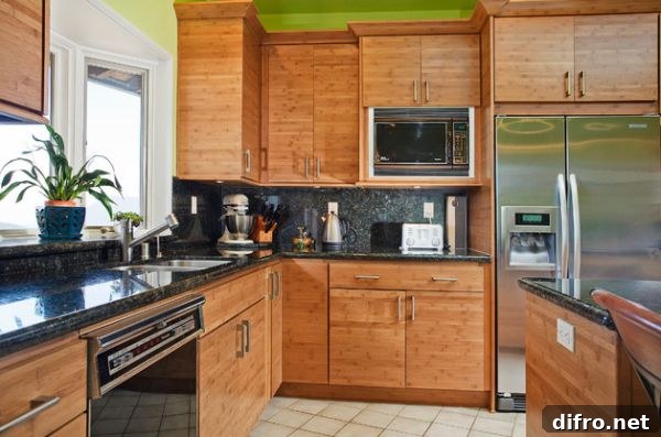 Bamboo cabinetry and a touch of green give this contemporary Californian kitchen an Asian flavor