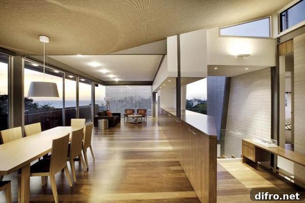 Living area opening onto terrace with bay views