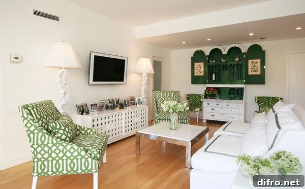 Imperial Trellis by Kelly Wearstler on the chairs blends with the surrounding green shades