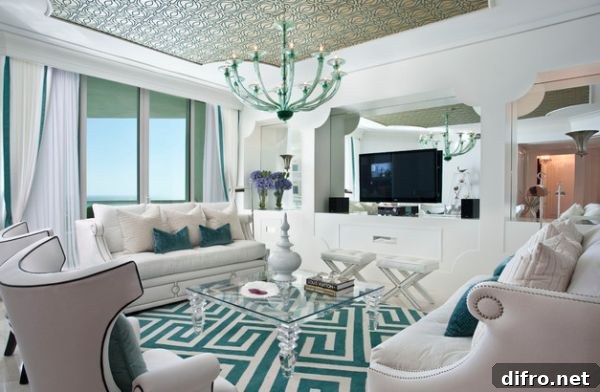 Modern living room in white and Tiffany blue clad in Hollywood Regency style
