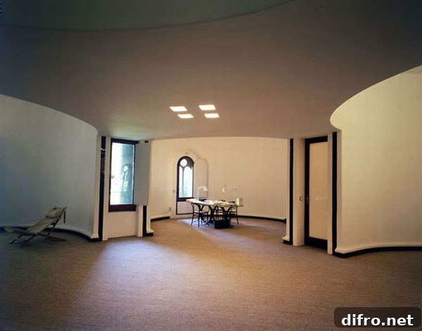Dining area with marble table and concrete architecture