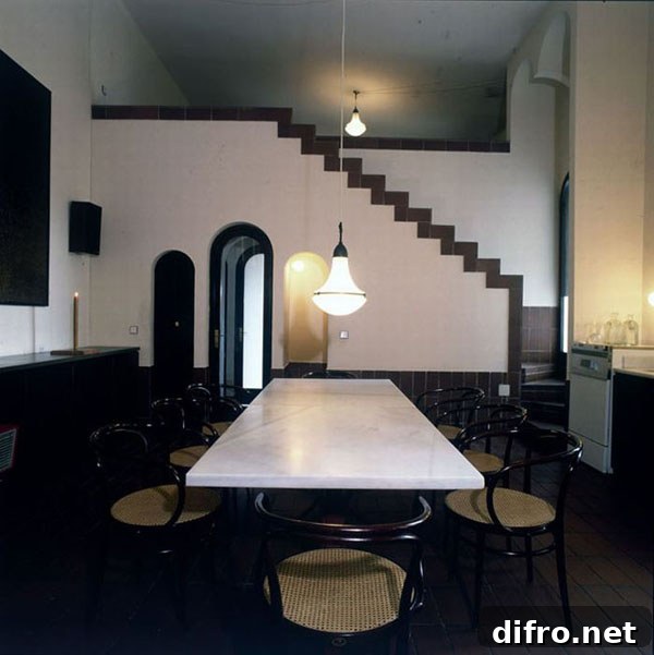 Arched niches and soft curtains inside a converted factory