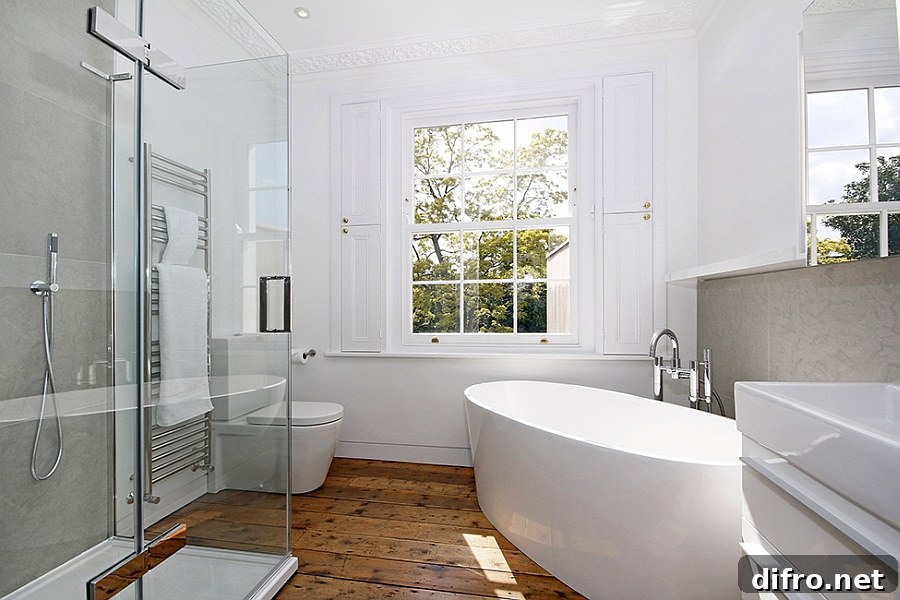Contemporary bathroom in white with standalone tub