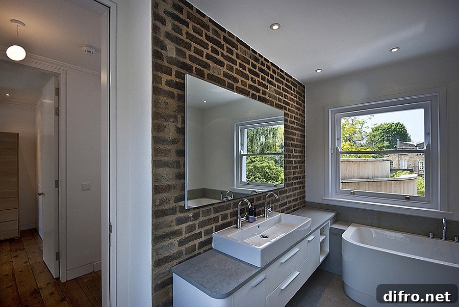 Cool exposed brik wall in the modern bathroom