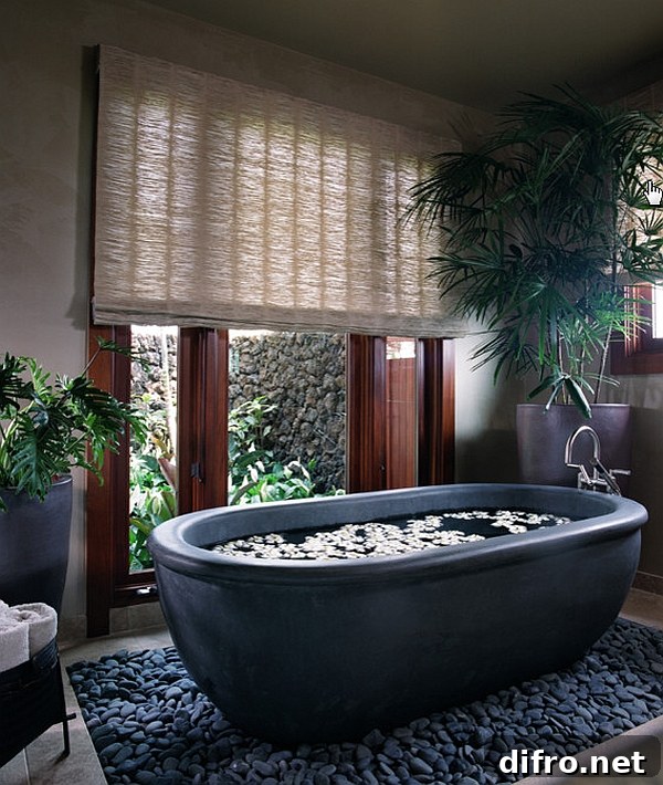 Beautiful basalt tub placed in a bed of river rocks