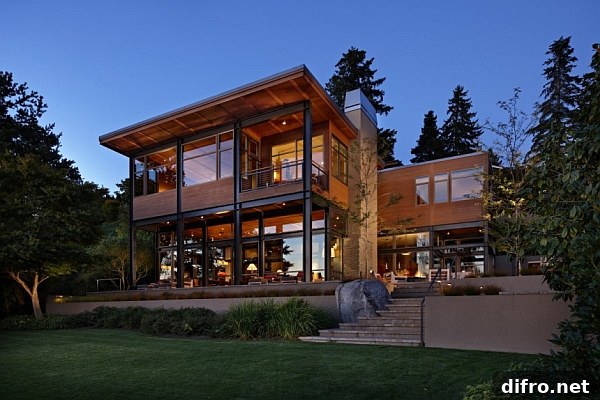Glass lake house with bold steel frame