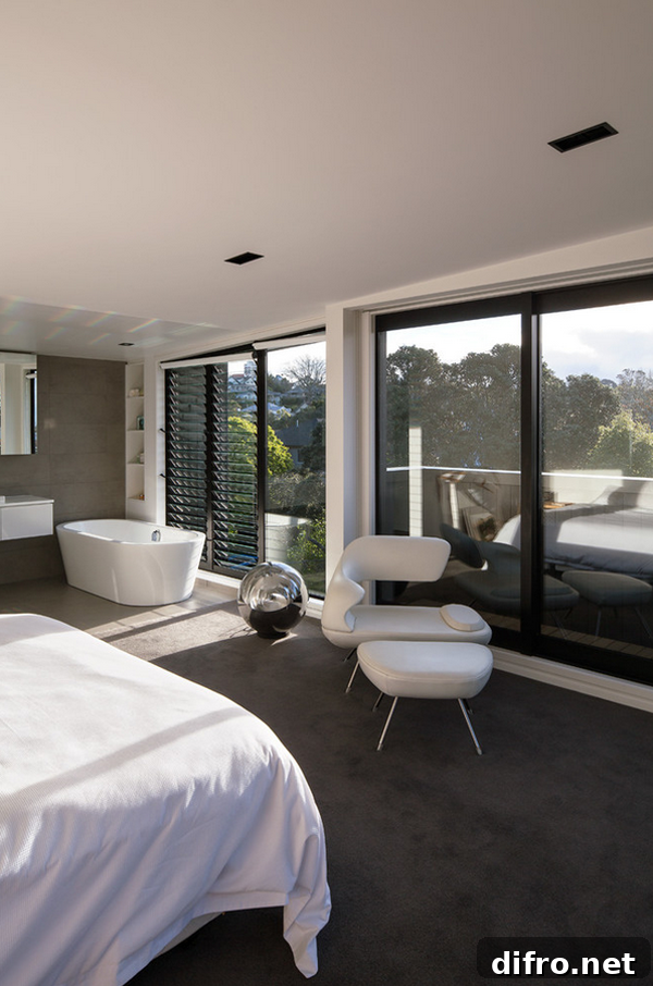 Open-plan bedroom with bathtub and vanity